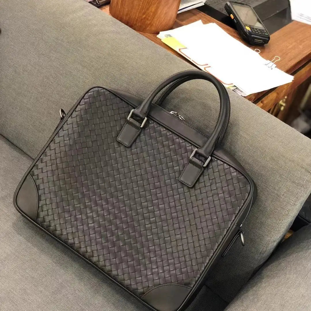 Luxury black woven leather laptop briefcase, men’s executive designer handbag for office and business travel.