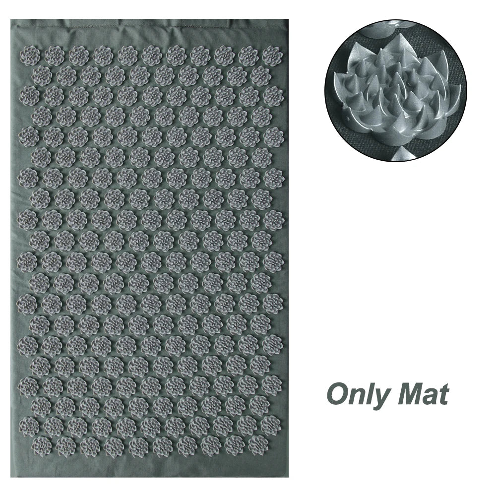 Gray acupressure yoga mat featuring numerous lotus-shaped plastic needle discs with a close-up view of a single spike.