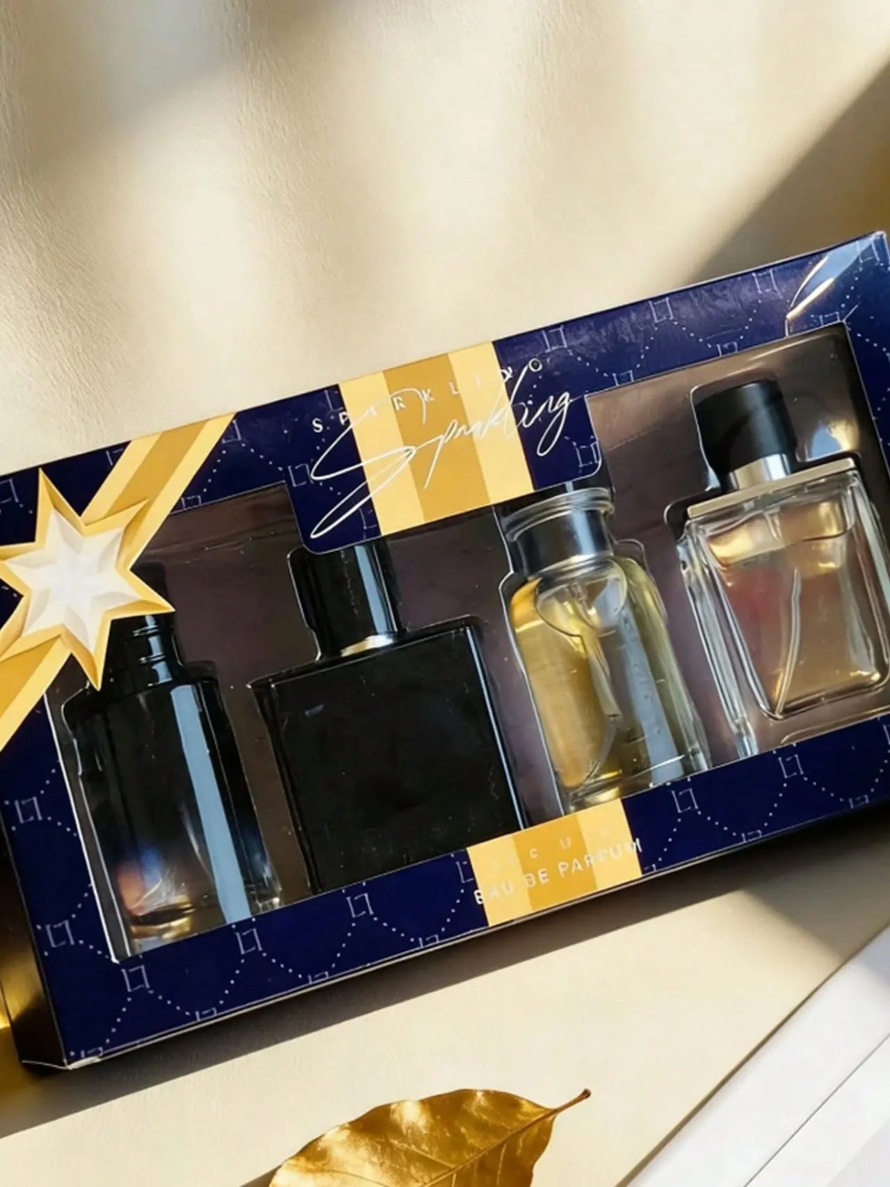 BOOS Sparkling 4pc Men’s Eau de Parfum gift set with assorted luxury glass perfume bottles in a blue decorative box.