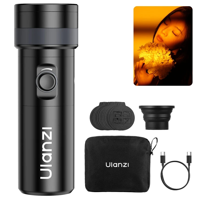 Black handheld LED photography light with color filters, silicone diffuser, carrying pouch, and USB-C charging cable.