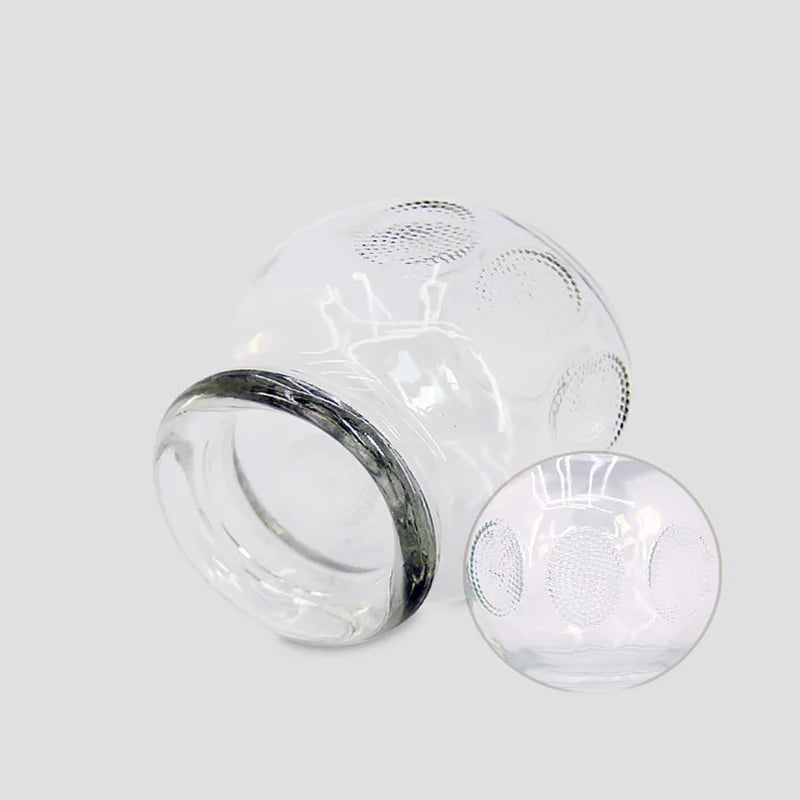 Extra thick clear glass cupping therapy cups with textured grip for professional or home use fire cupping treatment.