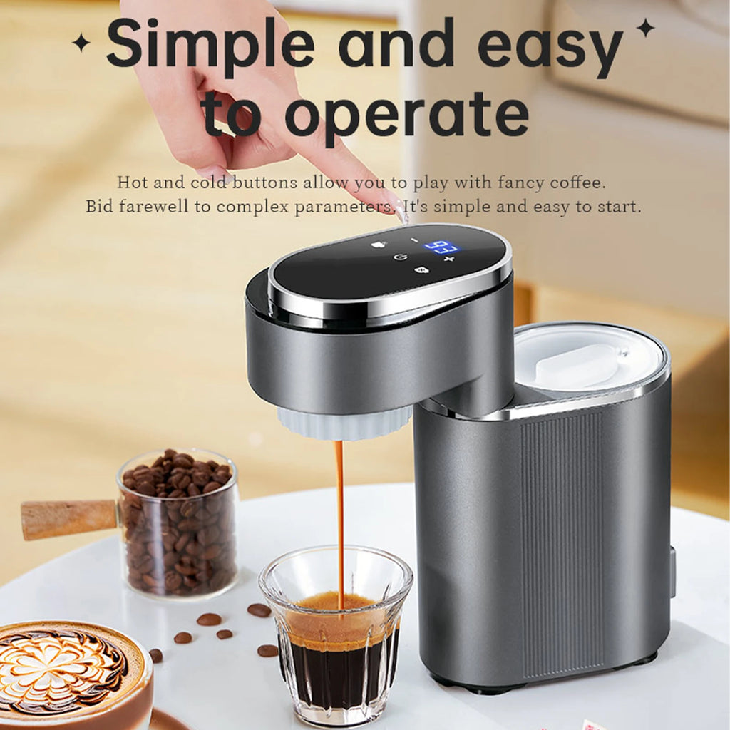 Grey electric coffee maker with digital touch display brewing espresso into a small glass cup on a white table.