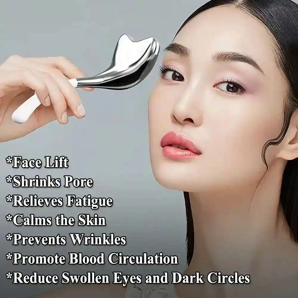 A hand holds a metallic, heart-shaped rose gold cryo facial massage tool near a woman's face.