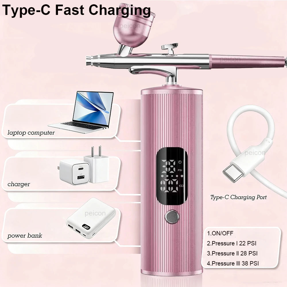 Pink portable airbrush nail kit with Type-C charger, power display, and adjustable pressure settings for nail art.