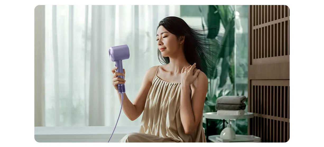 MIJIA H701 purple high-speed water ion hair dryer with sleek, ergonomic design for professional quick hair drying.