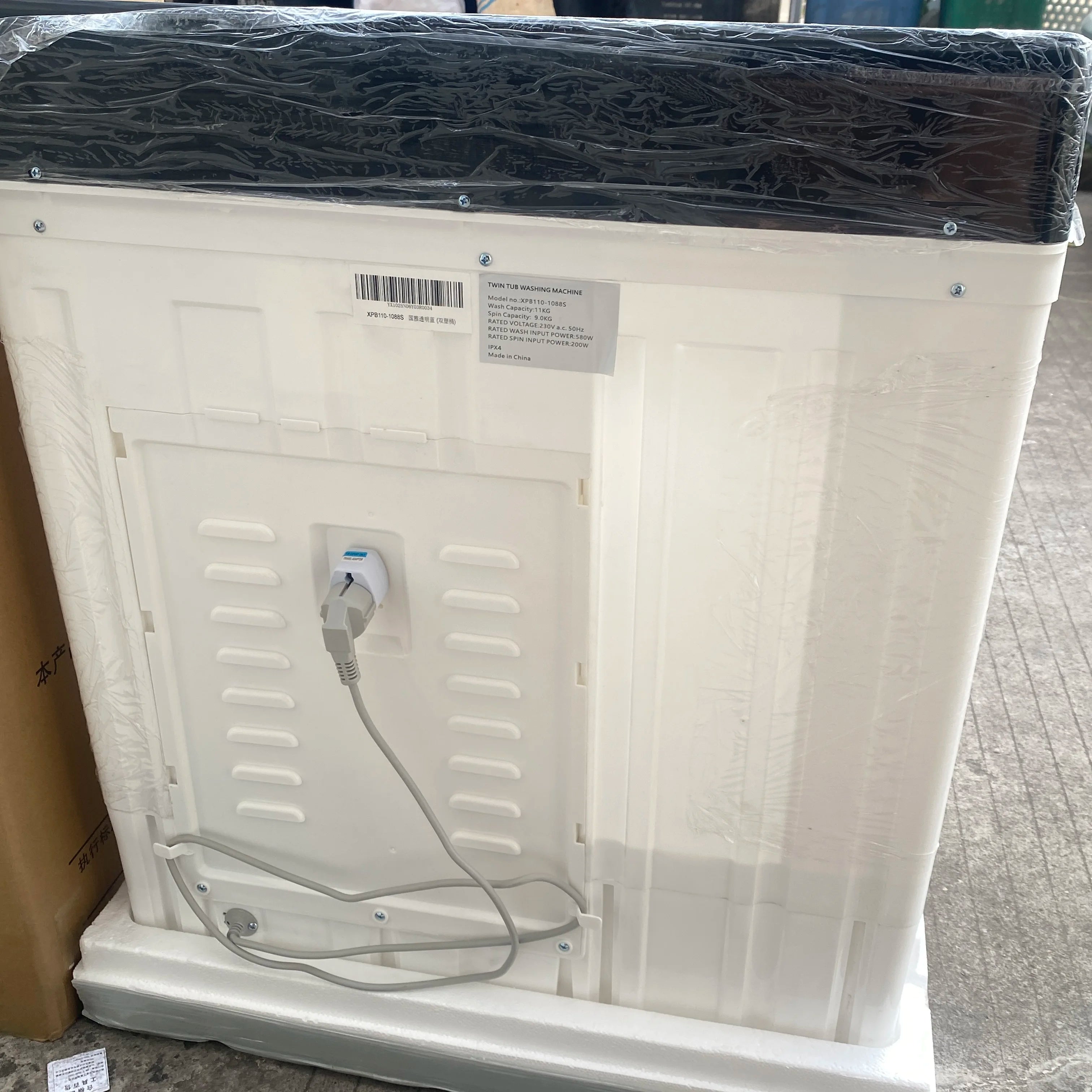 Tidesmit 11kg large capacity twin tub washing machine showing top lid controls and dual tub interior design