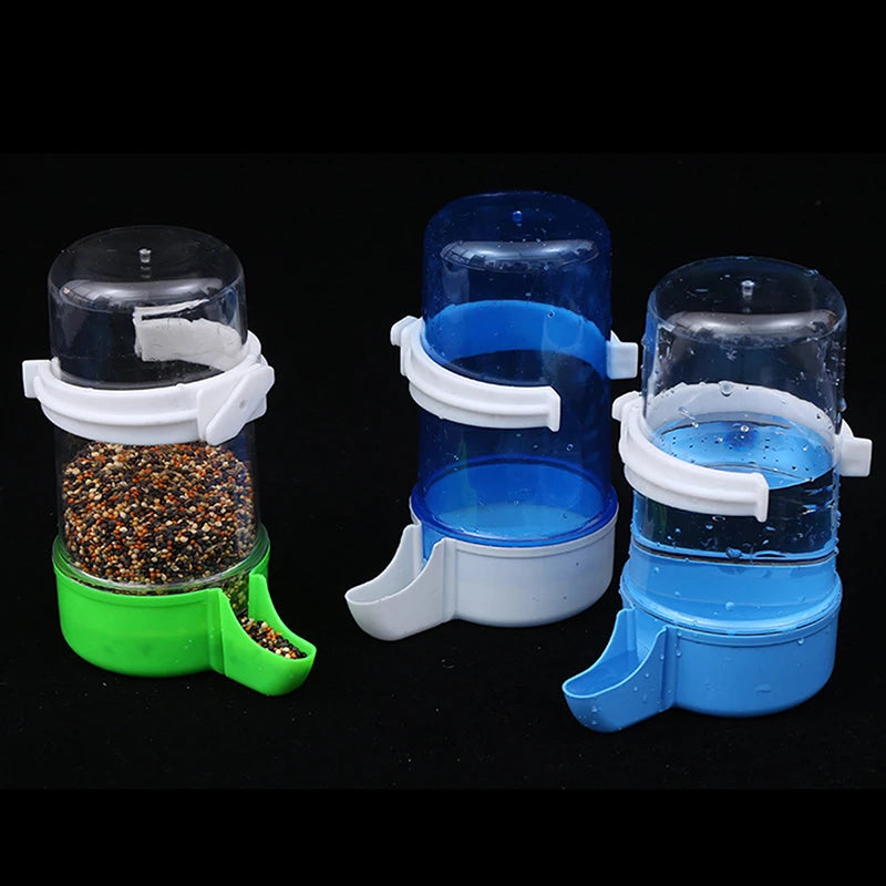 Automatic plastic bird feeder and water dispenser set for parrot cages with easy-fill bowls in green and blue.