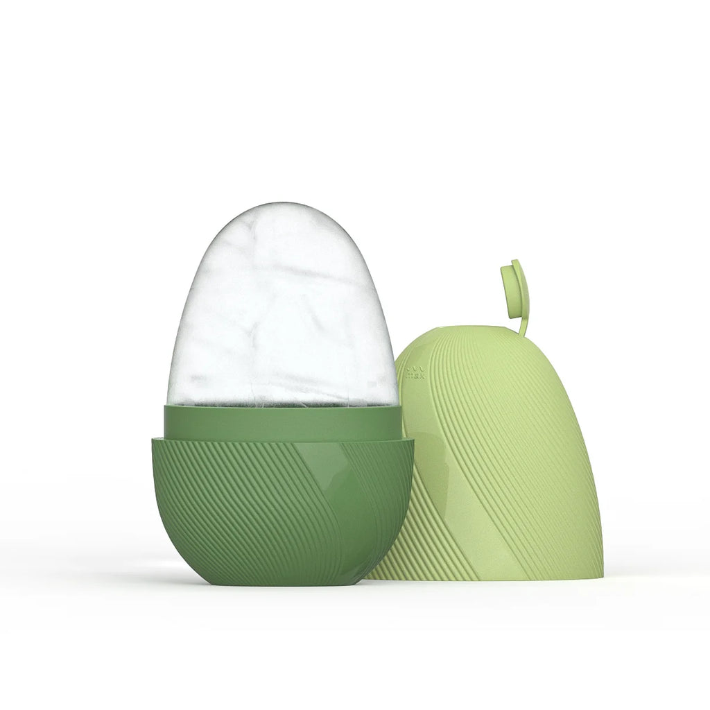 Egg-shaped ice face roller with a textured dark green base and a light green lid against a white background.
