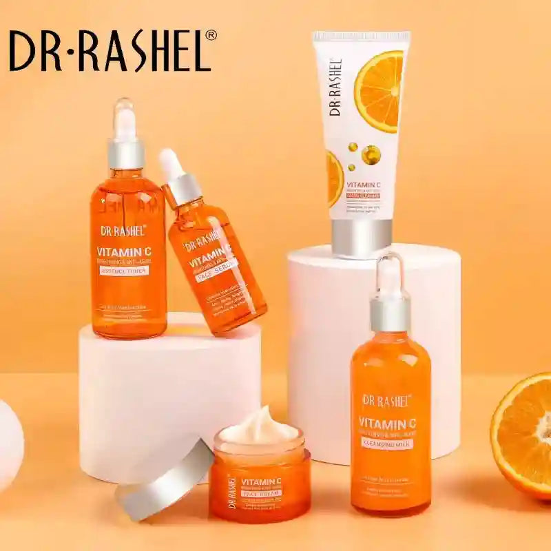 Dr. Rashel Vitamin C skincare set: brightening toner, serum, cleanser, and cream in orange bottles for glowing skin.