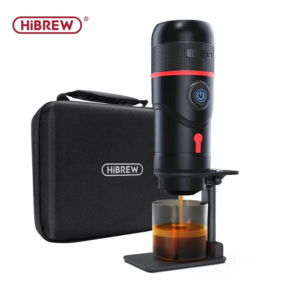 HiBREW portable espresso maker in black with carrying case and cup brewing fresh coffee on a white background.