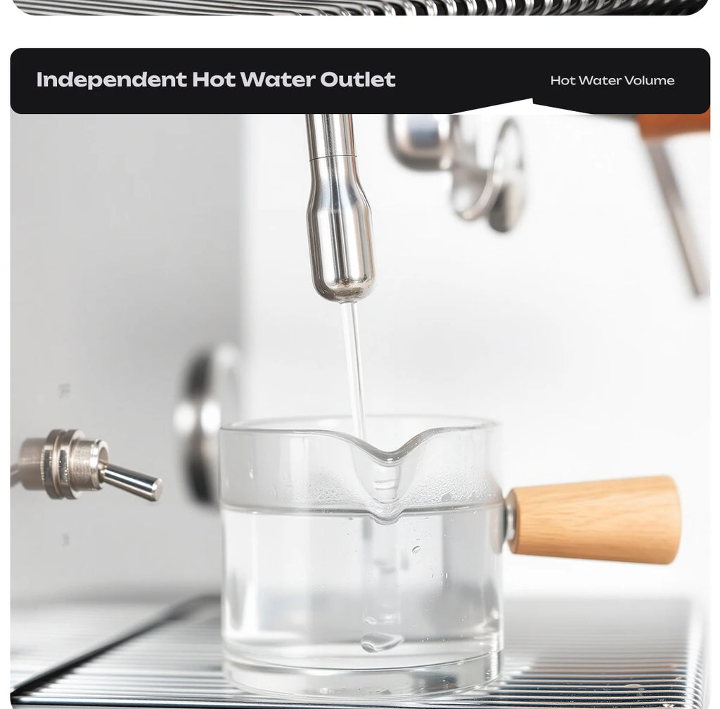 Stainless steel espresso machine independent hot water outlet dispensing water into a small glass cup with wood handle.