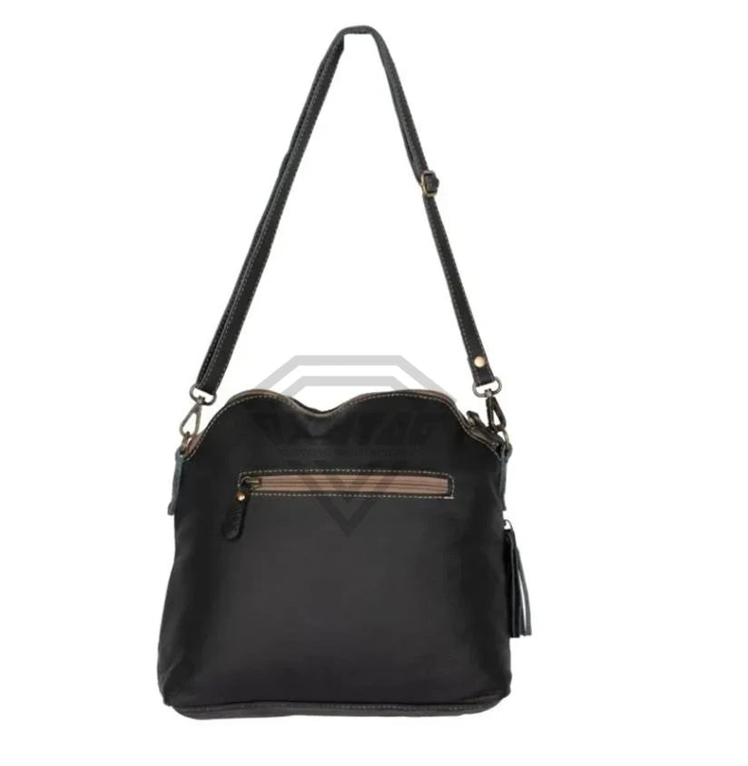 Black leather cowhide crossbody shoulder bag with a zippered pocket, tassel, and adjustable strap. Designer handbag.