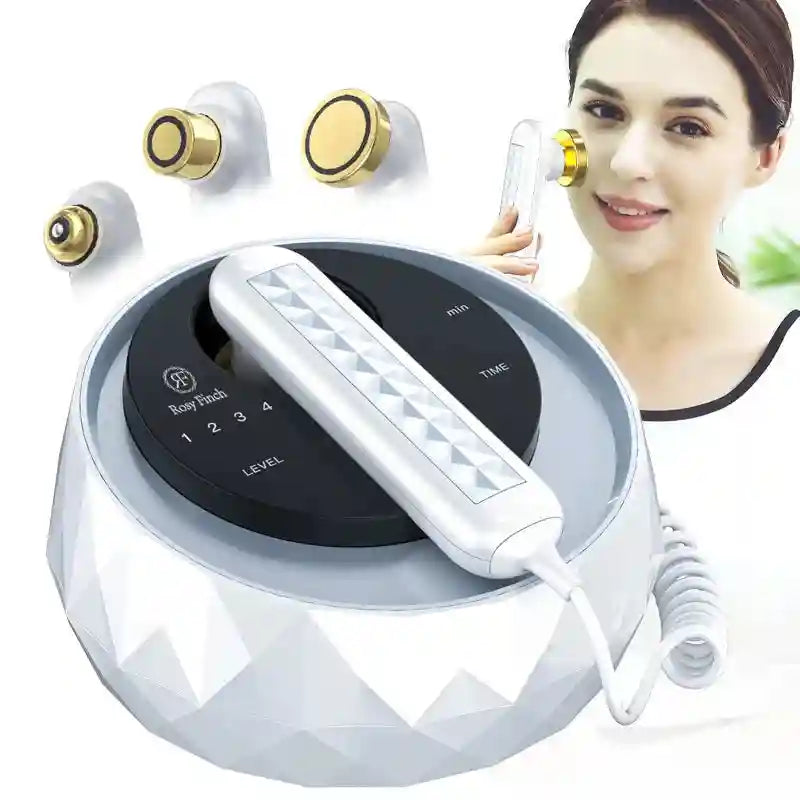 White, faceted skincare device base with handheld wand, gold-tipped attachments, and display for levels and time.