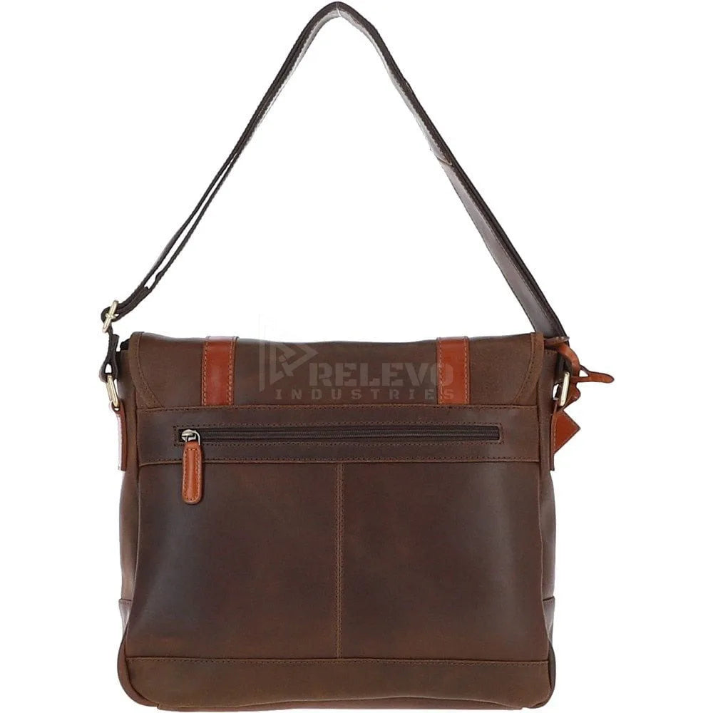 Minimalist brown leather messenger bag with top handle and zip pocket, ideal as a luxury lightweight travel handbag.