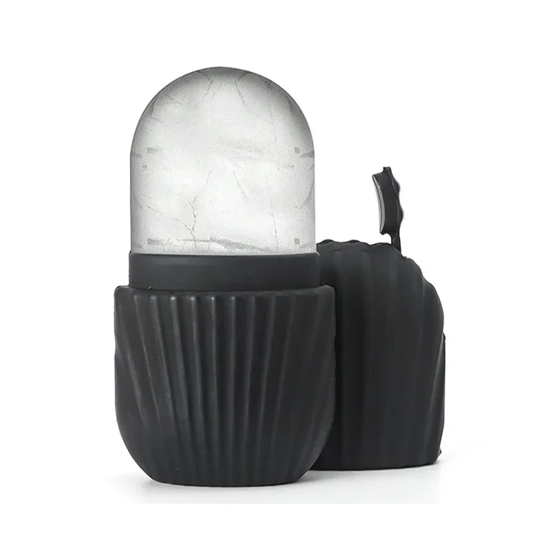 Black ice face roller with a frozen dome and a ribbed silicone handle, standing next to its matching cap.