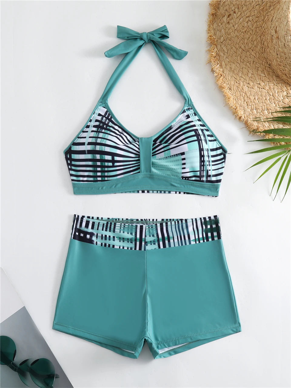 Tidesmit teal high-waisted bikini set featuring a halter-neck top and shorts with a black and white geometric print.
