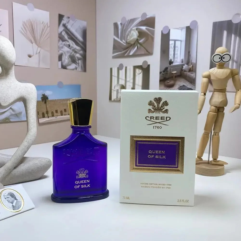 Creed Queen of Silk EDP: Luxury unisex perfume in a deep blue glass bottle with gold cap and elegant white gift box.
