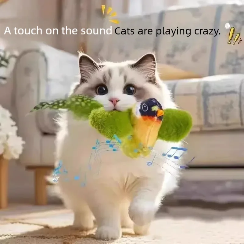 Fluffy white cat playing with an interactive plush bird toy that chirps and flaps for active kitten exercise.