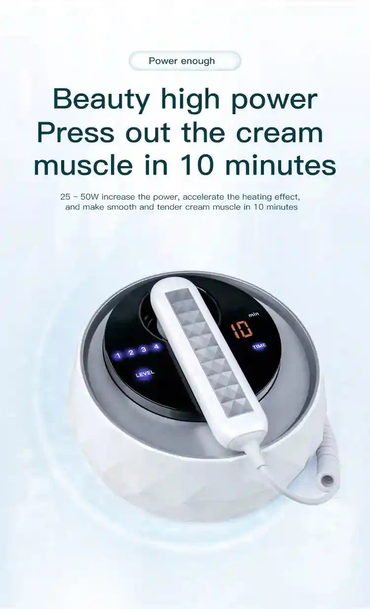 White, faceted, round beauty device with a hand-held wand, digital level/timer display, and coiled cord on a white base.