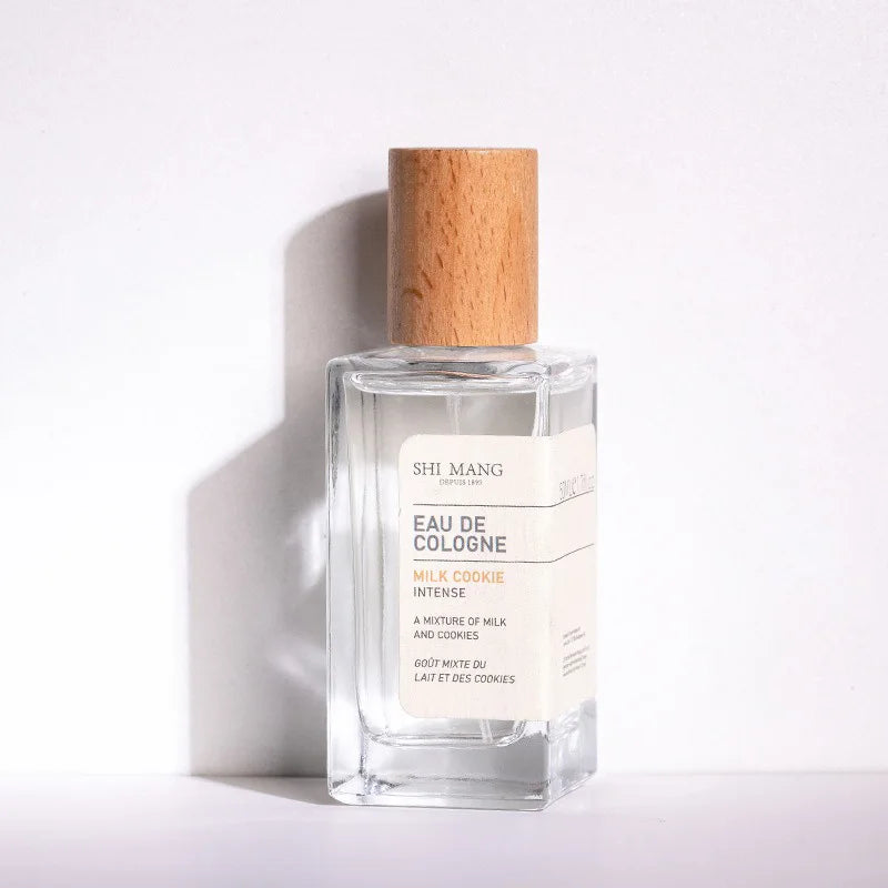 Shi Mang Milk Cookie Eau de Cologne: 50ml square glass bottle with wooden cap, unisex long-lasting gourmand fragrance.