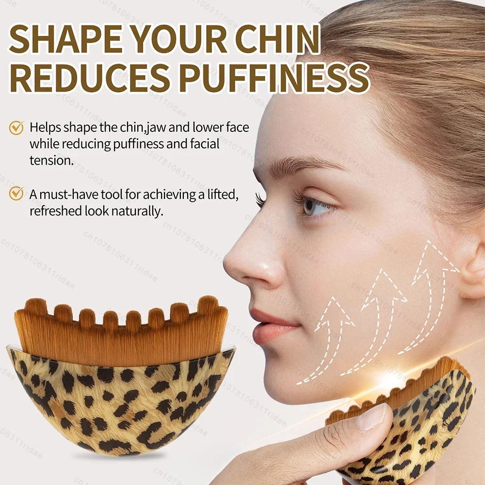 Curved, leopard-print facial massage brush with brown bristles for lymphatic drainage and facial contouring.