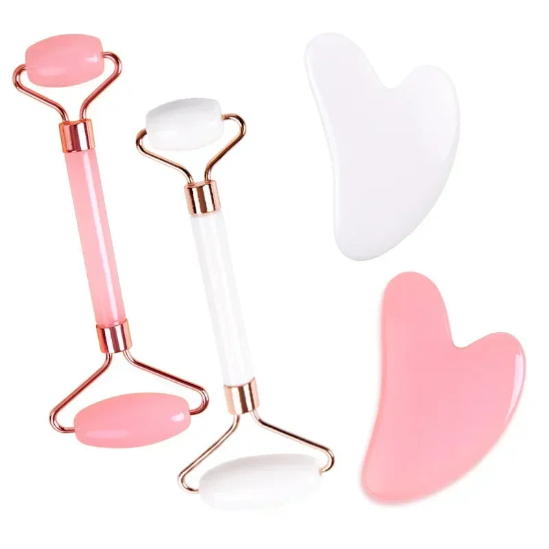 Pink and white resin jade roller and heart-shaped gua sha scraper set for facial lifting and anti-wrinkle massage.