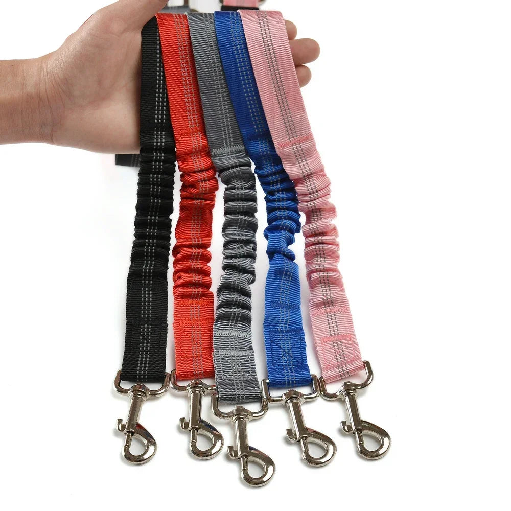 Adjustable reflective elastic dog car seat belts in various colors for safe, secure travel for all dog sizes.