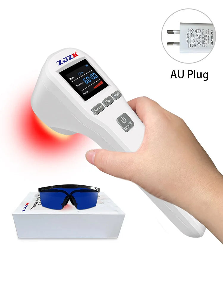 Handheld white red light therapy device with digital display, buttons, safety goggles, and AU power adapter.