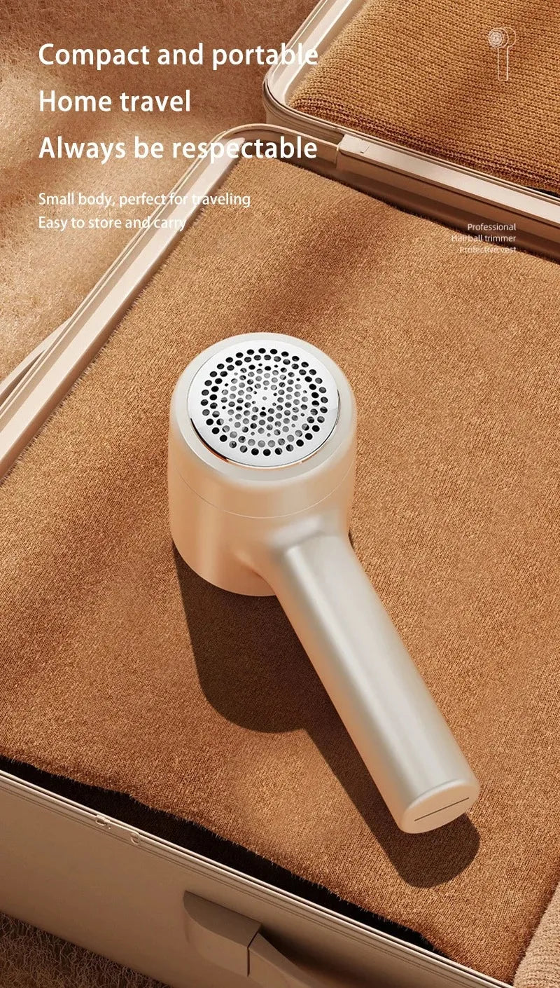 Tidesmit rechargeable fabric shaver removing lint and hair balls from clothing, side angle view of laundry appliance.