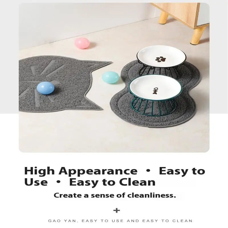 Raised white ceramic cat bowls on stands with grey cat-shaped feeding mats for easy, clean dining.