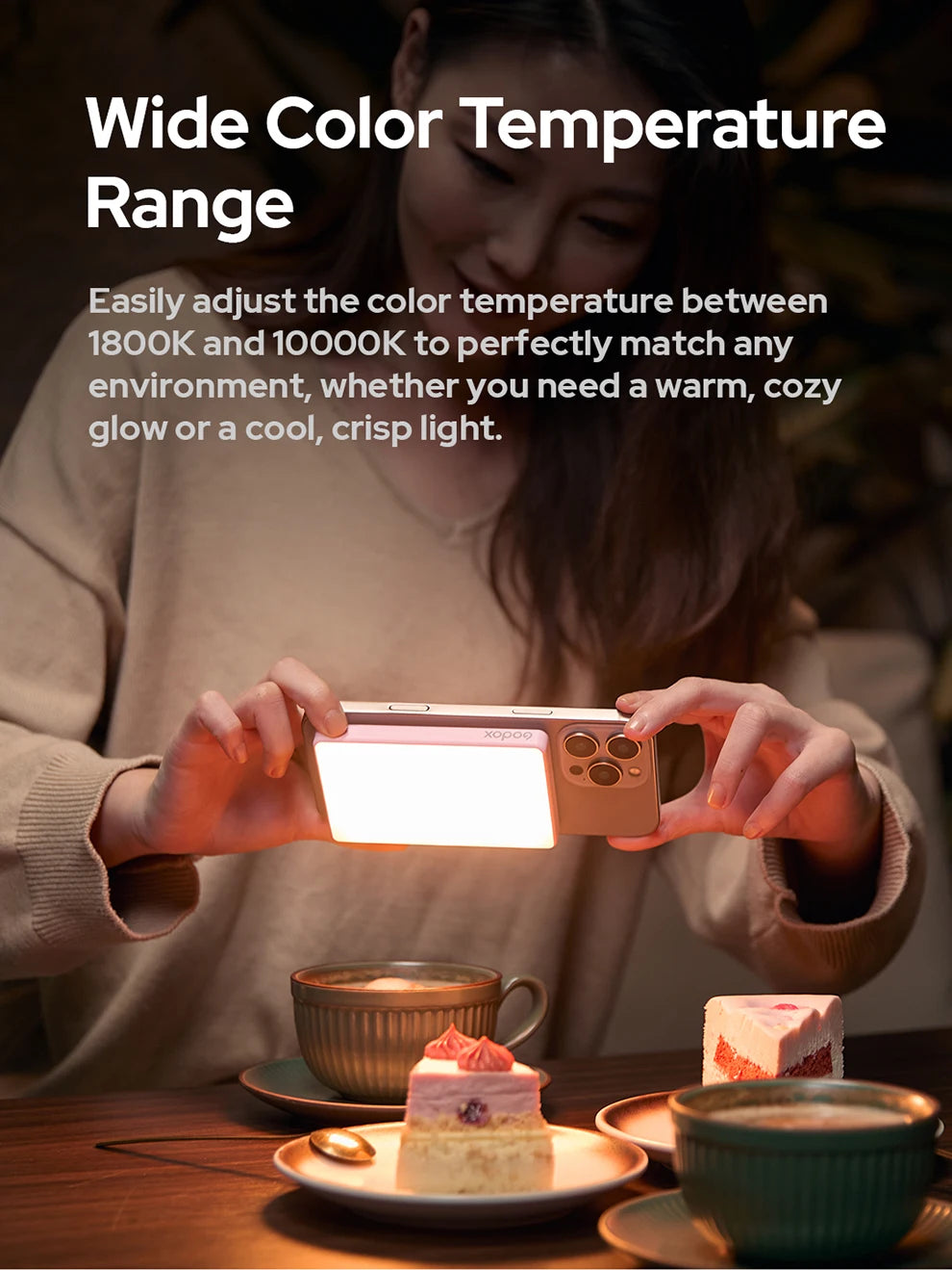 Small, rectangular, pink LED phone light attached to a smartphone, used for illuminating food photography.