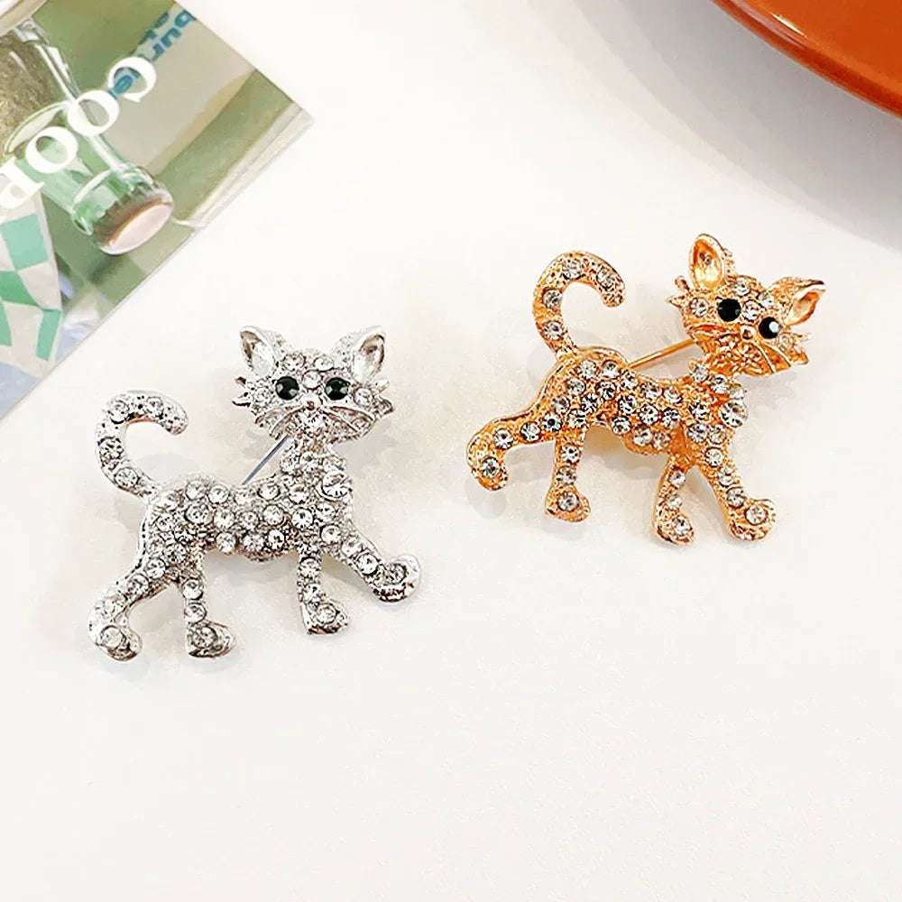Sparkling crystal cat brooches in silver and gold, perfect lapel pin jewelry gifts for cat lovers.