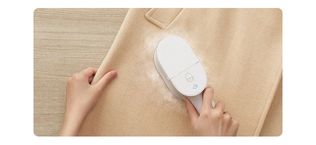 Tidesmit handheld garment steamer for clothes with electric steam cleaner and mite removal features, side view.