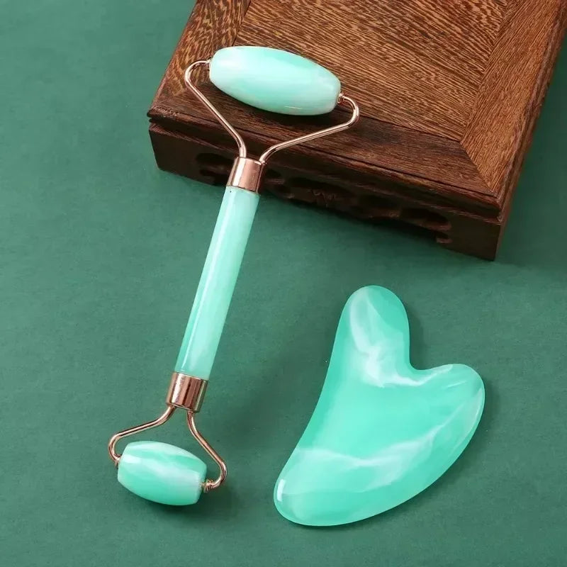 Green resin jade roller and gua sha scraper set for facial massage, anti-wrinkle skin lifting, and skincare routine.