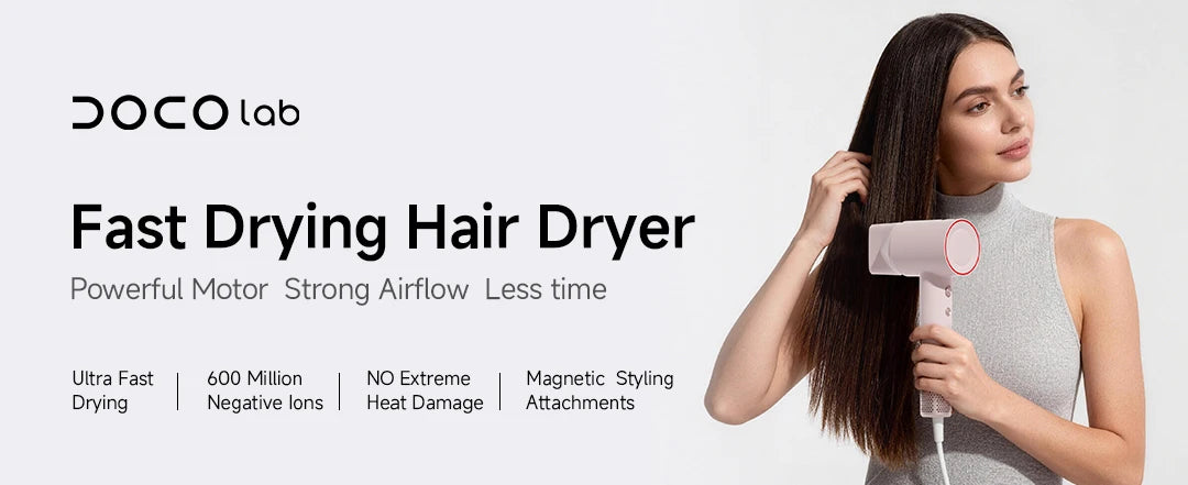 DOCO high-speed ionic hair dryer in light pink with magnetic styling nozzle, designed for fast, damage-free drying.