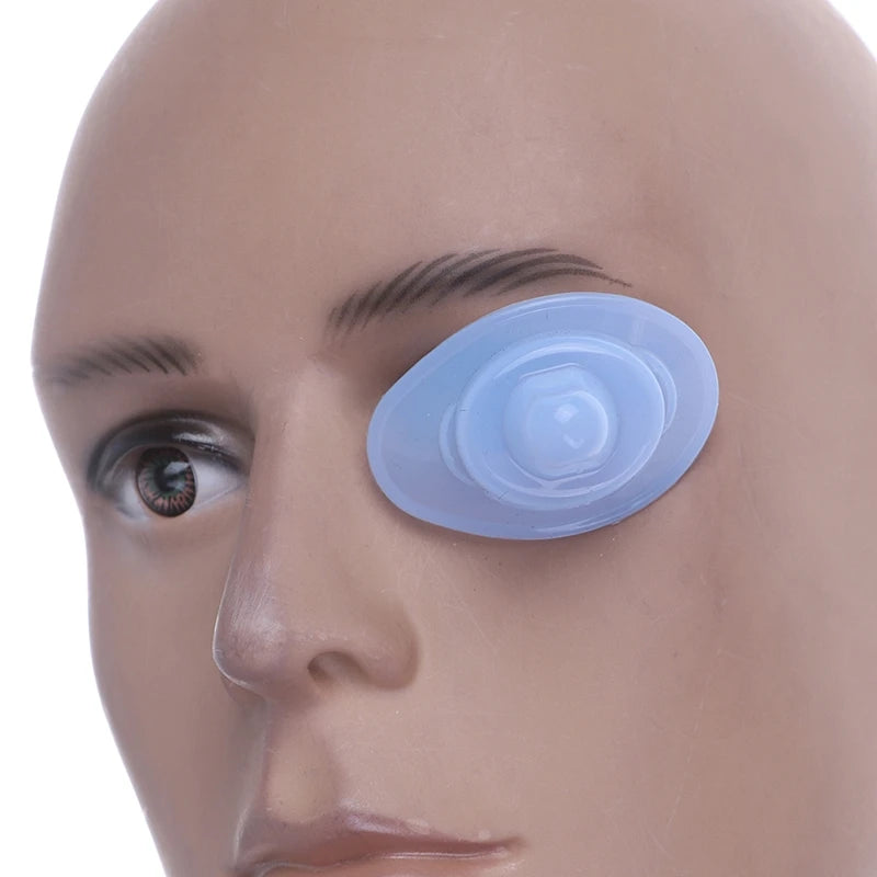 Reusable blue silicone eye wash cup positioned on a mannequin face for eye cleansing and relief.