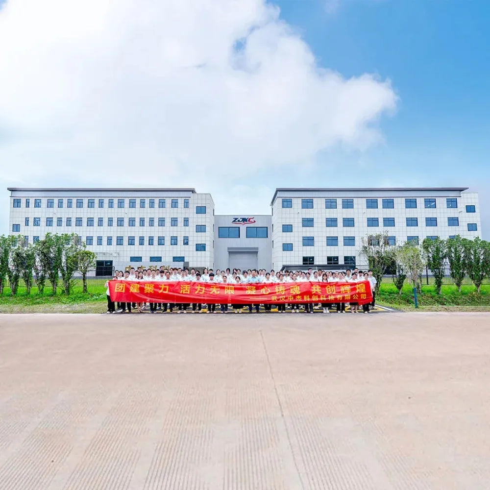 Frovab RTMS brain stimulation machine factory staff holding a banner in front of the clinical rehabilitation facility.