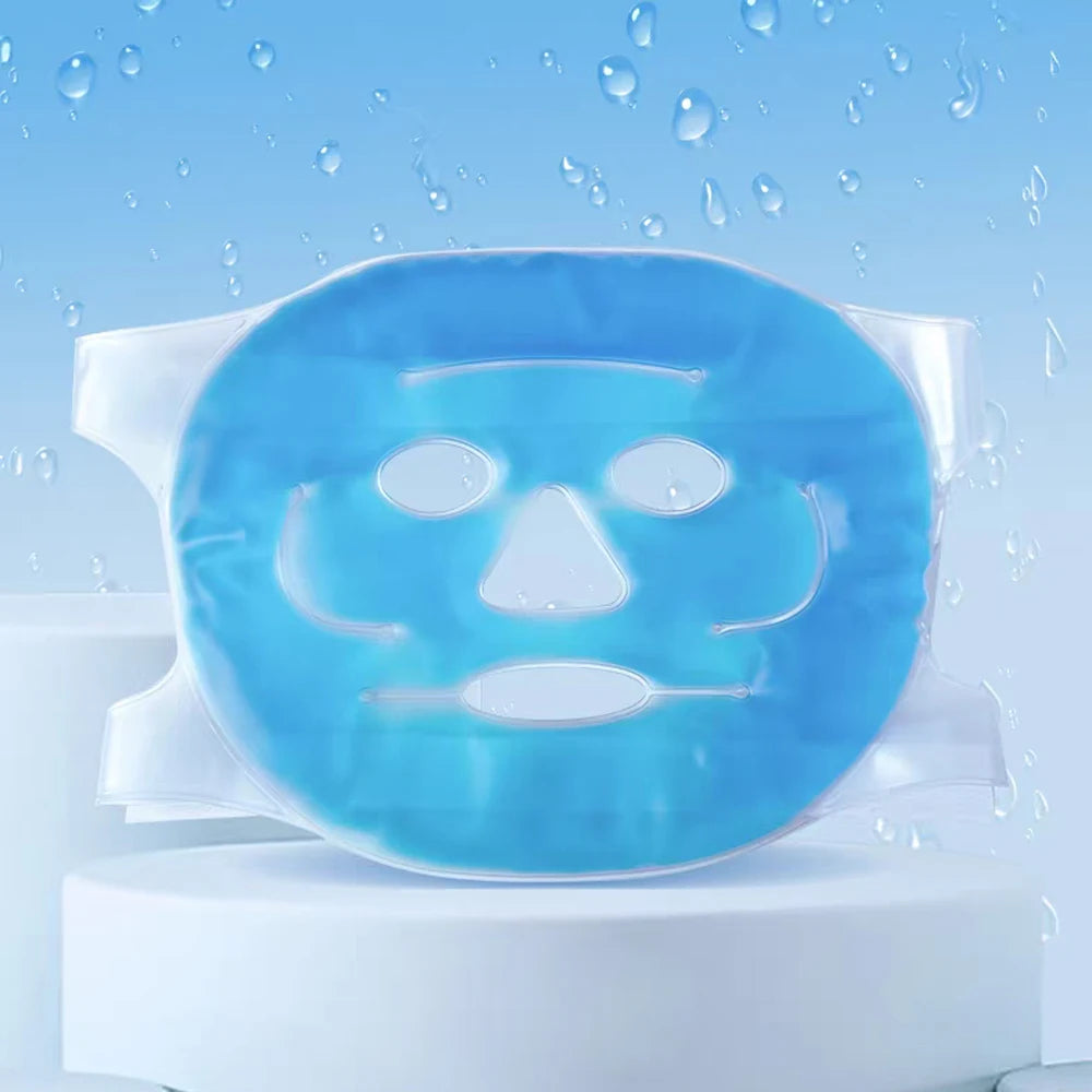 Blue gel face mask with cutouts for eyes, nose, and mouth, set on a white pedestal against a water-drop background.