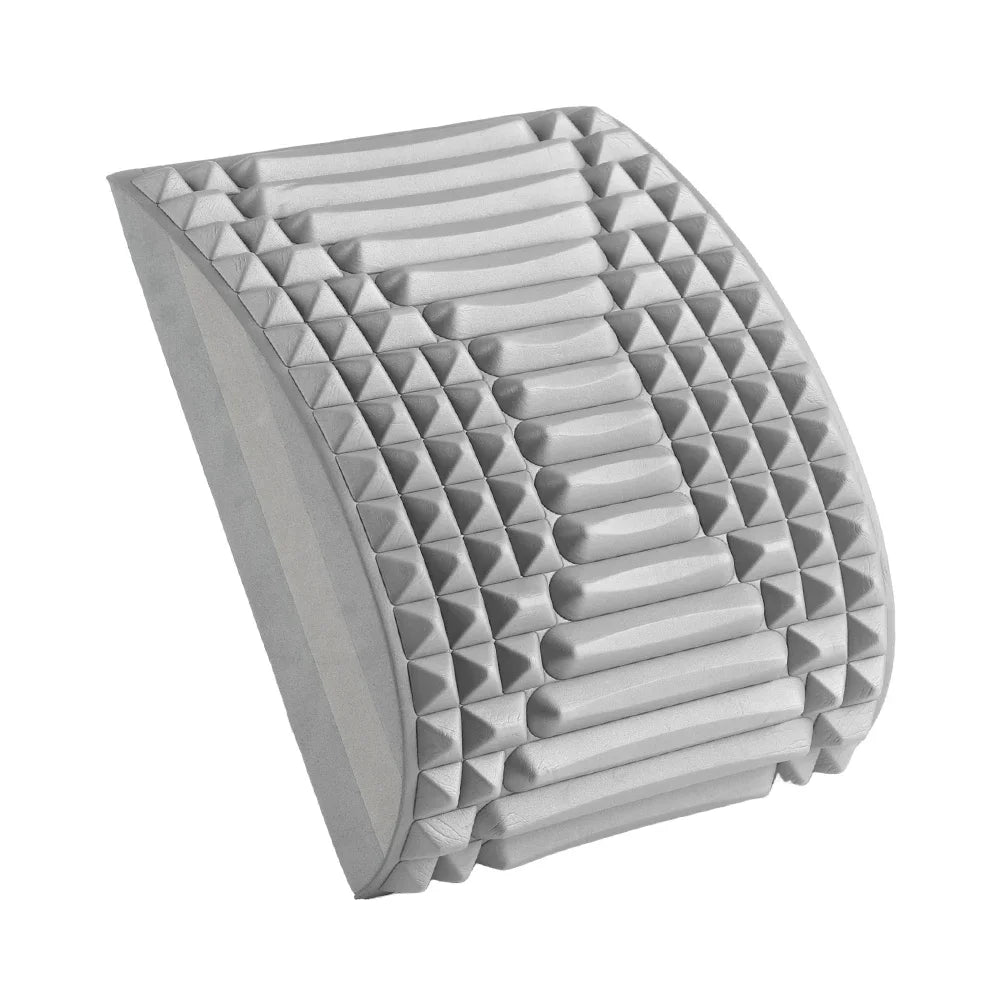 Grey arched back stretcher made of foam with textured massage nubs for lumbar support and spinal relief.
