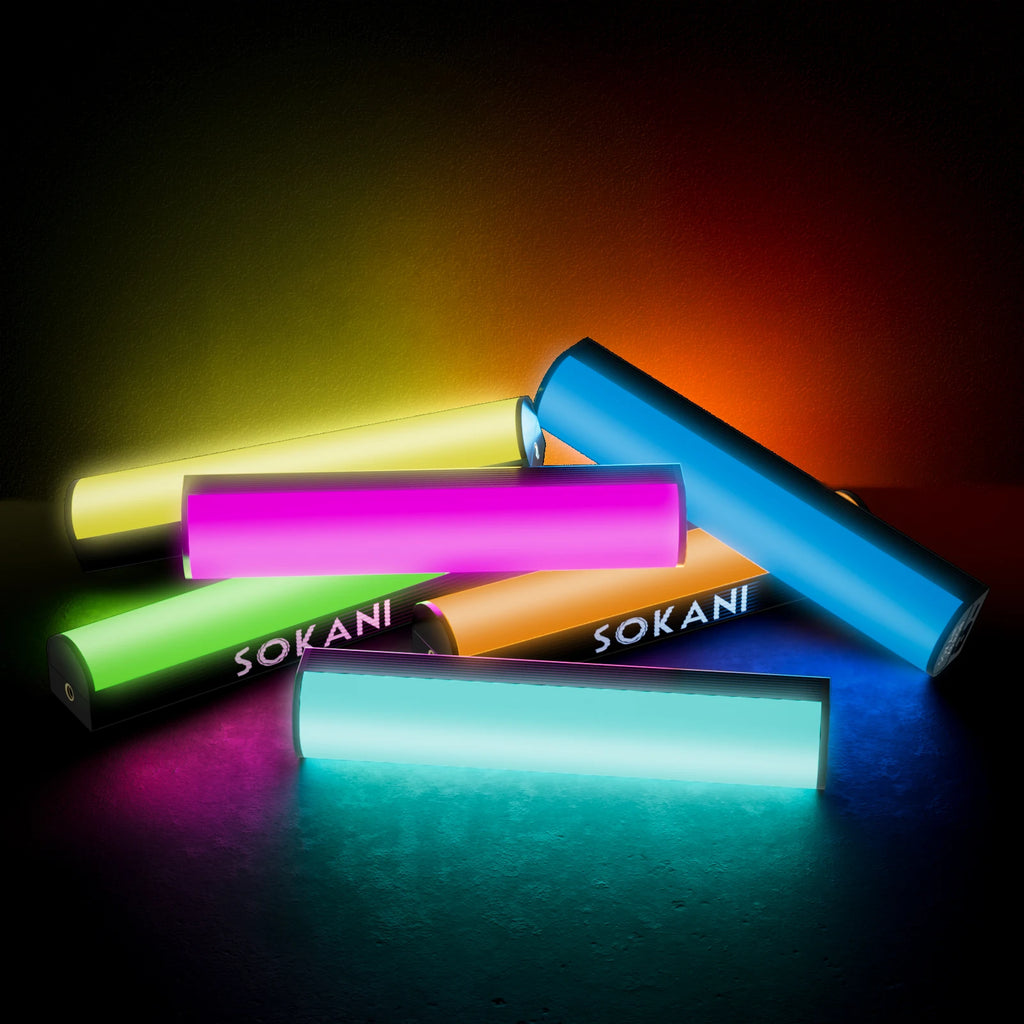Portable LED light sticks in various colors, used for creative video and photography lighting.