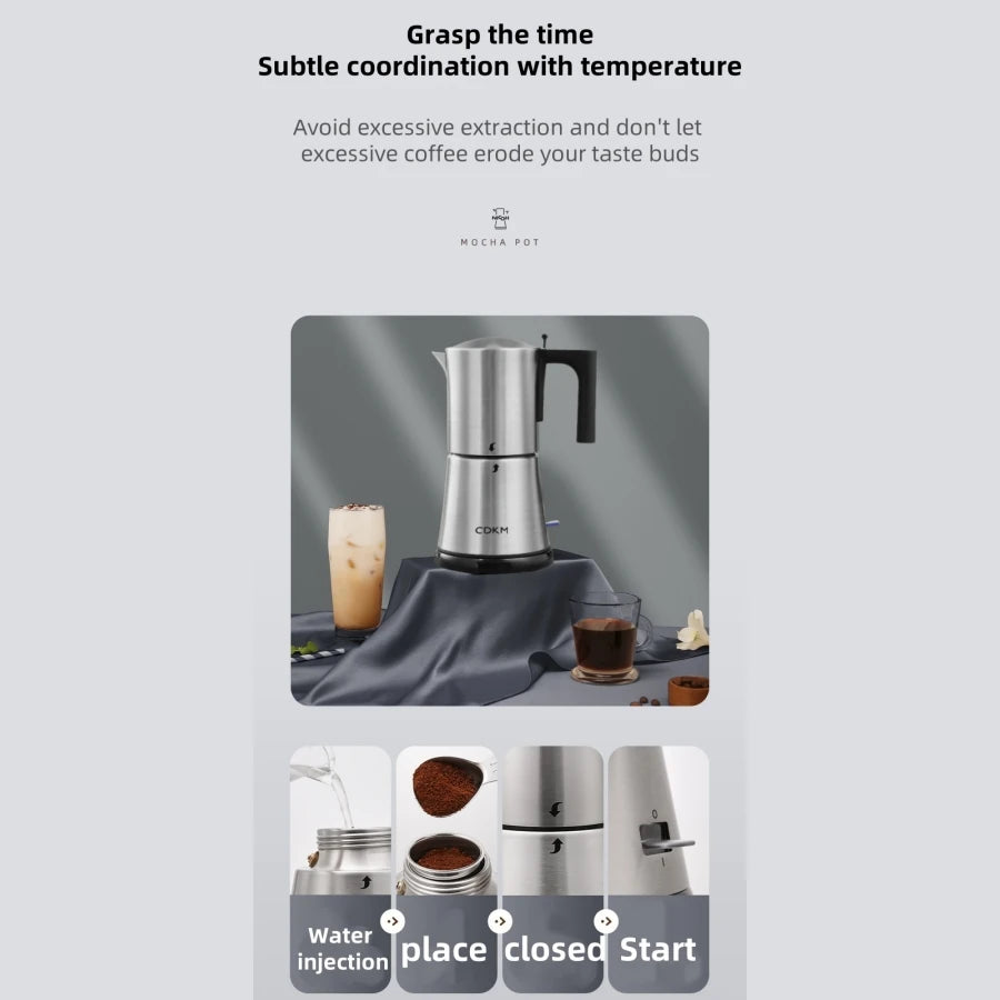 CDKM stainless steel electric mocha pot with black handle on a grey cloth display with coffee drinks.