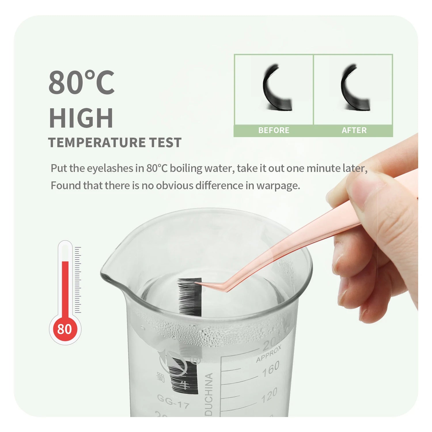 Rose gold tweezers hold black false eyelashes in a beaker of hot water to demonstrate heat resistance.