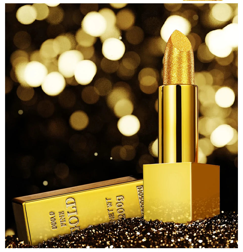 Long-lasting shimmering gold glitter lipstick in a unique gold brick tube on a sparkling, bokeh background.