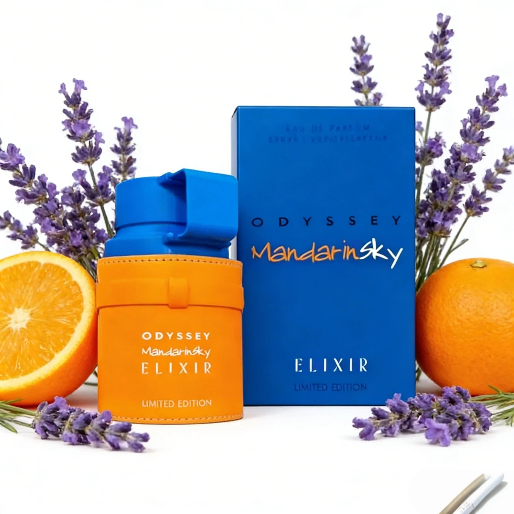 Odyssey Mandarin Sky Elixir eau de parfum in a cylindrical orange leather-wrapped bottle and matching blue box.