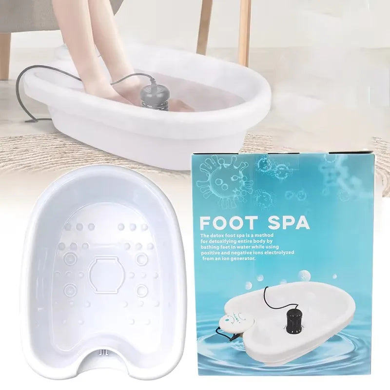 White ionic detox foot spa basin with ion generator for home therapy, shown in use with feet submerged.