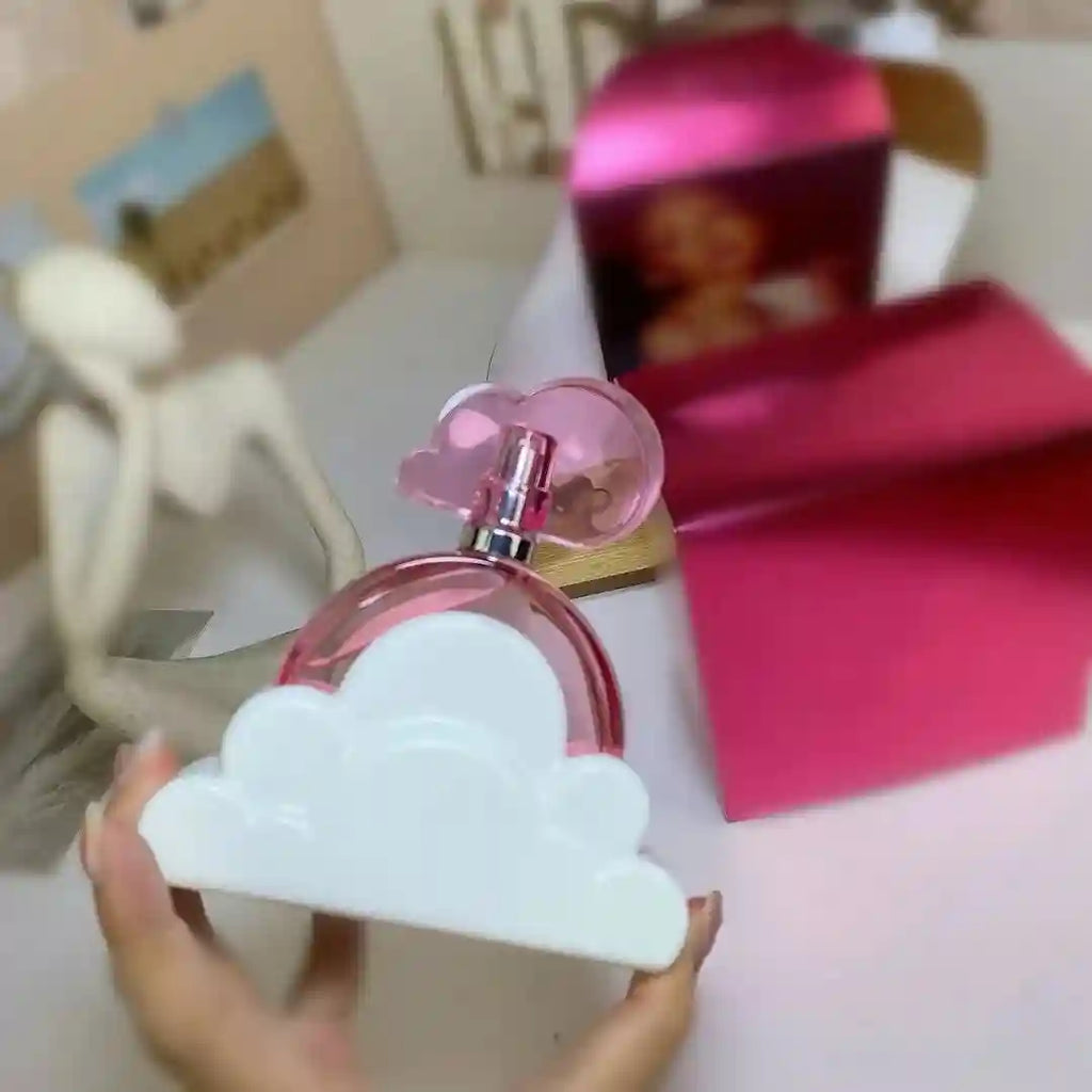 Classic Brand Ariana White Grand Cloud EDP 100ml: Pink cloud-shaped ladies' perfume bottle in white cloud base.