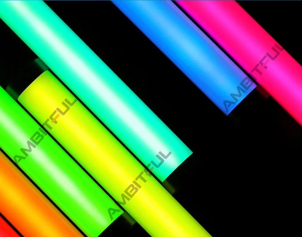 Cylindrical LED light wands in orange, lime, cyan, blue, and pink, used for photography and creative lighting.