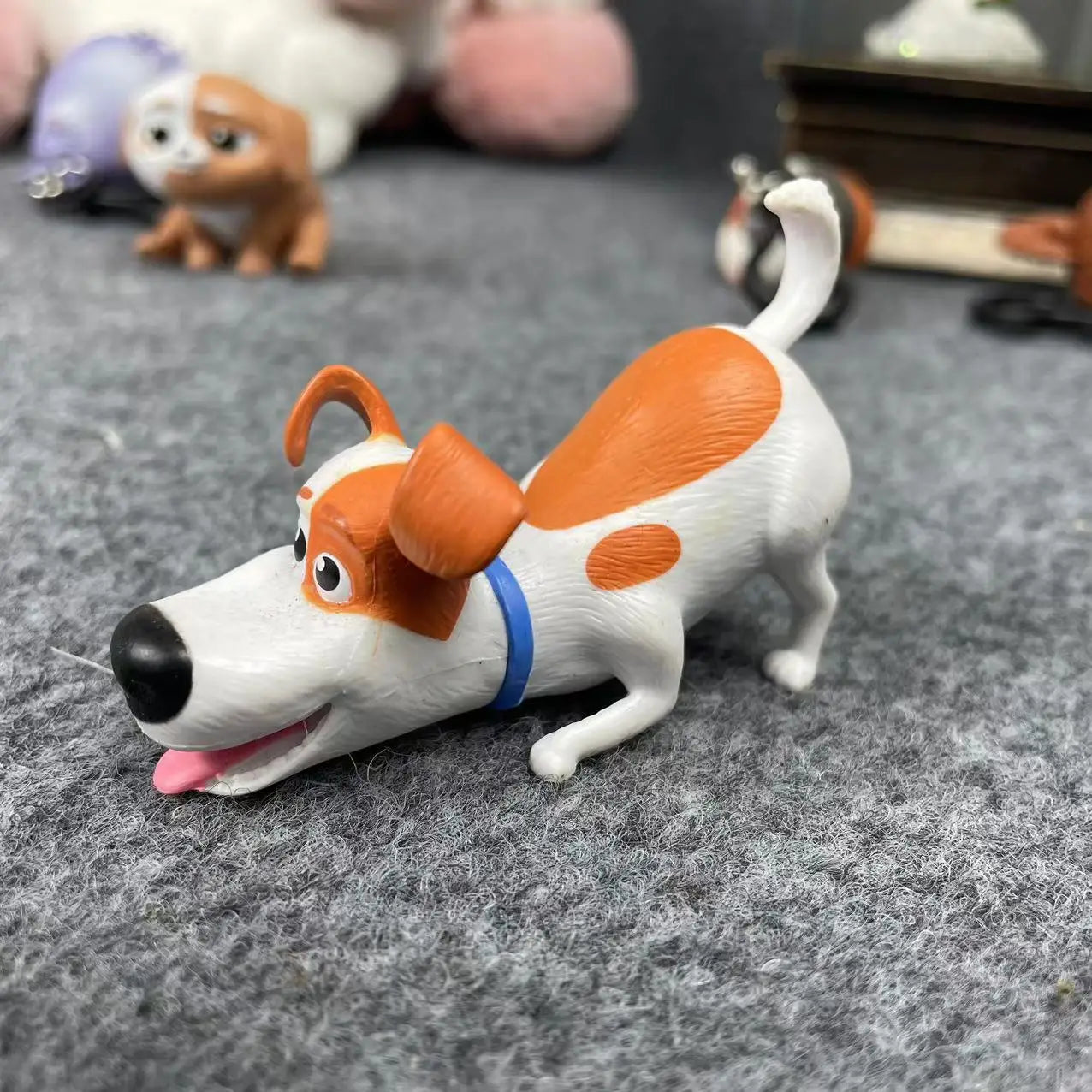 Secret Life of Pets Max figurine, cute orange and white plastic dog toy for kids or desk decoration.