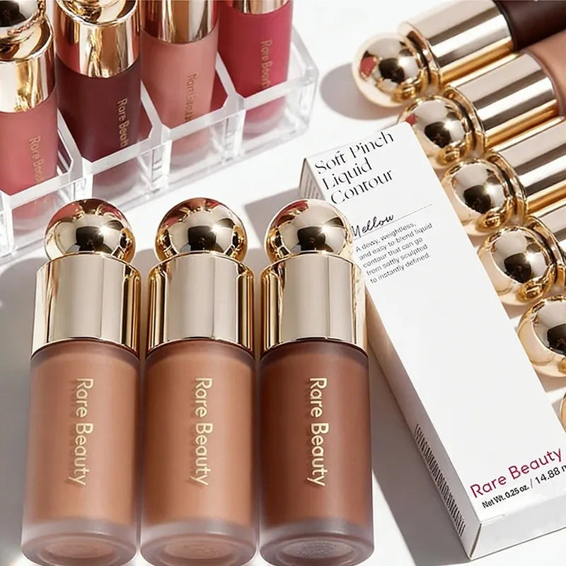 Rare Beauty Soft Pinch Liquid Contour bottles in varying brown shades with gold caps and product packaging.