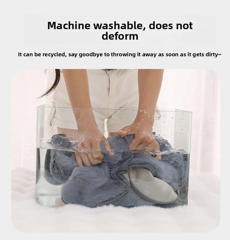 Machine washable extra-large plush grey dog bed mat being hand-washed to show durability for large pets.
